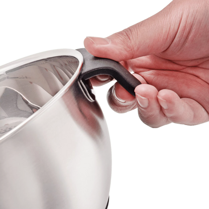 Hand holding a black handle on a silver pot against a white background